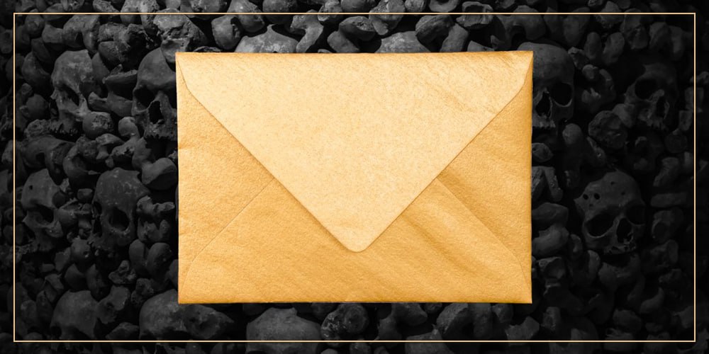 skulls in the background, golden envelope in the foreground